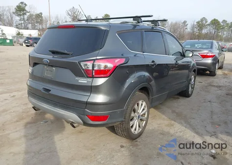 2017 Ford Escape Titanium z USA, uszkodzony, nr VIN 1FMCU0J94HUB95227
